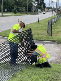 Staff putting up snow fencing