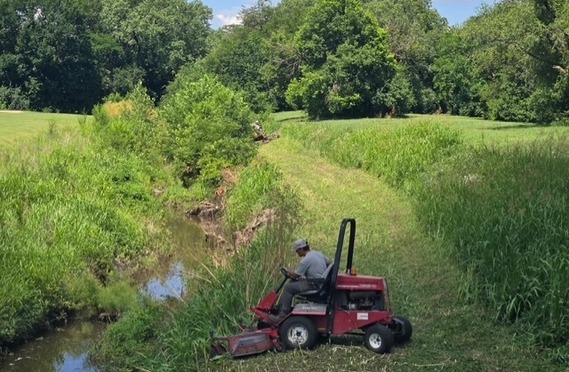 Parks staff mowing waterways