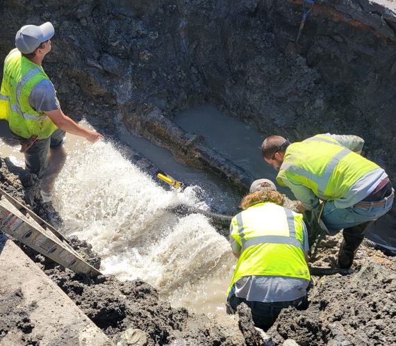 Staff working on water main break at 4th and Main