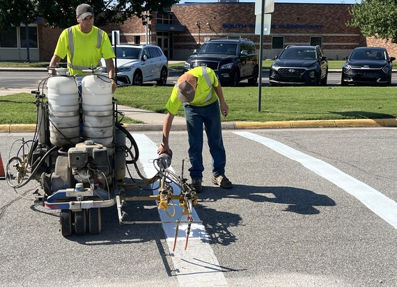 Street staff painting crosswalk