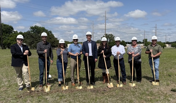 City Commissioners and other officials pose with shovels at Harvest Pointe groundbreaking