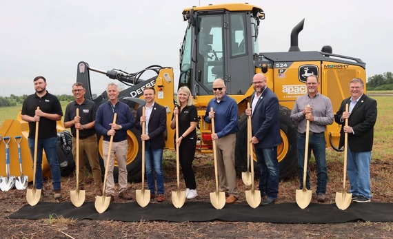 Officials from APAC and state and local government pose with shovels at groundbreaking event