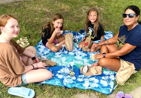 City Clerk Denise enjoying lunch with kids during SEAK