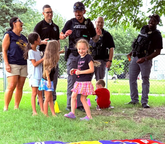 NPD playing yard games with kids during SEAK.
