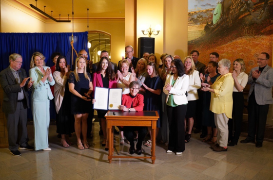 Governor Laura Kelly with survivors and advocates
