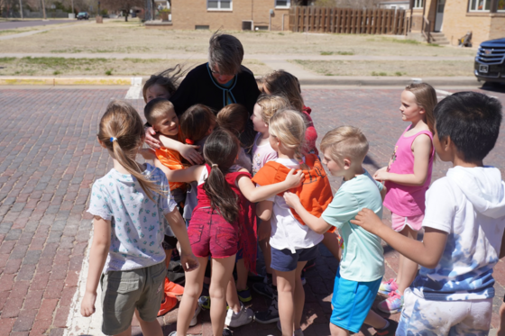 Governor Kelly with children in Ellis