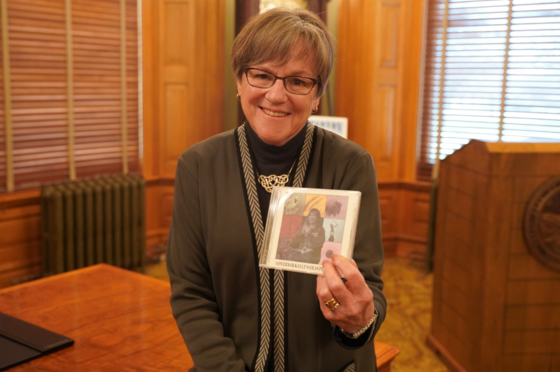 Governor Kelly with her custom Taylor Swift CD