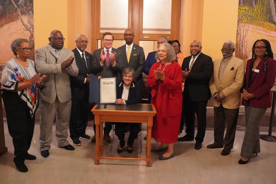 Governor Kelly and leaders with the Juneteenth proclamation