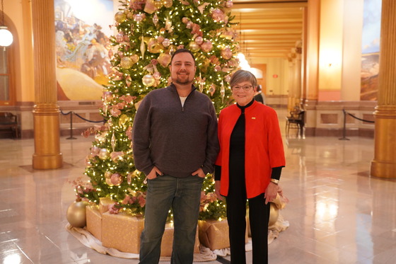 Governor Kelly and Troy Spain, who volunteers to decorate the tree each year with his mother