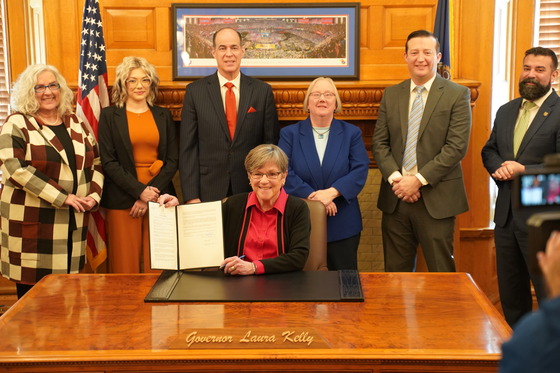 Governor Kelly with advocates at the Executive Order signing