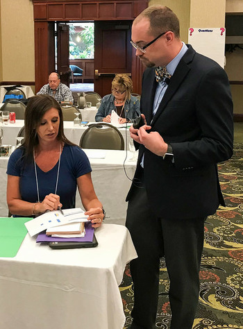Dr. Matthew Courtney and Crystal Sizemore work during the Data Use and Program Improvement session.