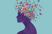 woman who is painted purple with flowers in her hair
