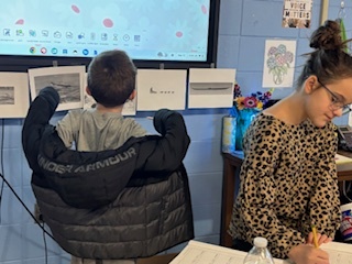 Student looking at board