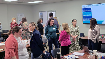 A group of educators discussing methods taught at Ky's March Leadership conference.