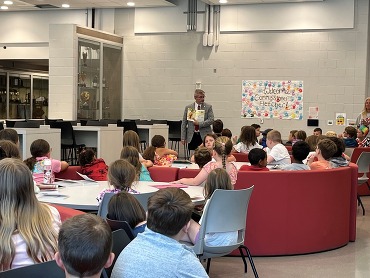 Commissioner of Education Robbie Fletcher reads to students at the Summer Boost site at Ludlow Independent