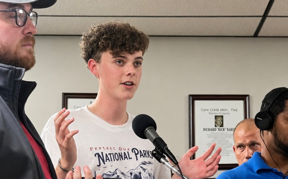 Student talking to a group of people
