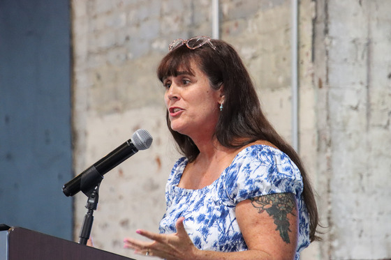 Molly Seifert speaks into a microphone