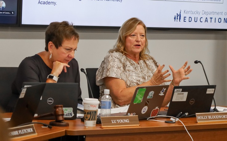 Two individuals sitting at a table