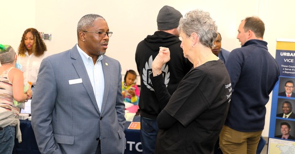 Councilmember James Brown in conversation with community member