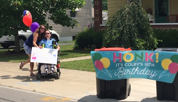Colby with birthday sign
