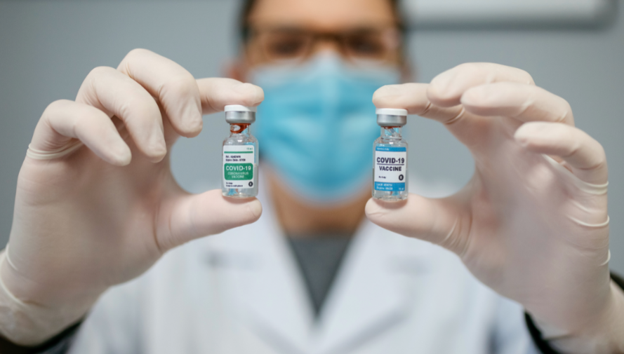 Doctor Holding Vaccines