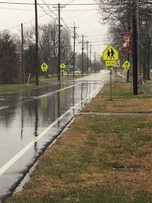 Hess & Pindell signs at crosswalk