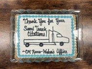 Ben and 6th District officers with a cake 