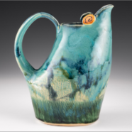 Photograph tile of a ceramic pitcher. The colors are a green, dark blue, and yellow marbling