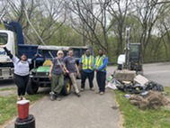 Cleanup crew in front of a truck