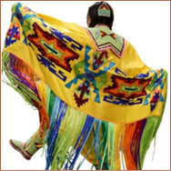 Indigenous woman dancing in traditional native regalia 
