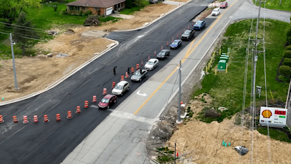 Drone footage above Mineola Pike near Olympic Blvd.