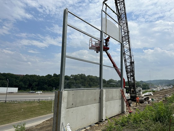 Noise screen barrier being installed in Covington