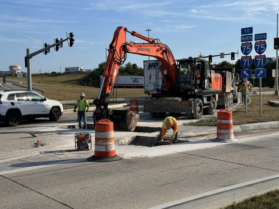 Crews remove a concrete slab of Richwood Road