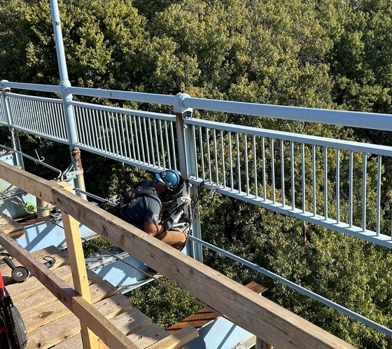 Welder working on the blue bridge