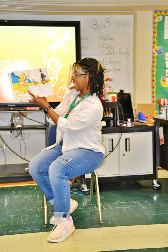 white hills lady reading with face shield