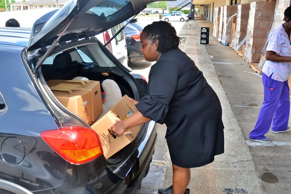 pastor jackson putting boxes in car