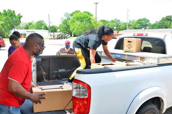 pastor jackson putting boxes in truck