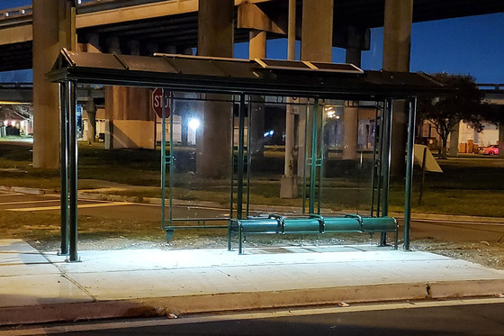 New lighted bus shelter in the evening