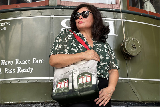 Model holding tote bag