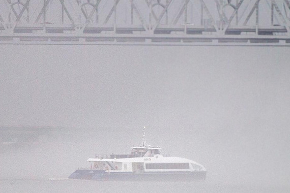 Ferry on river in dense fog