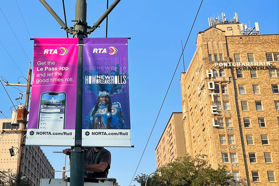 Banners being installed on St. Charles Ave.