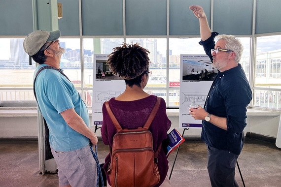 Residents reviewing presentation at ferry terminal.