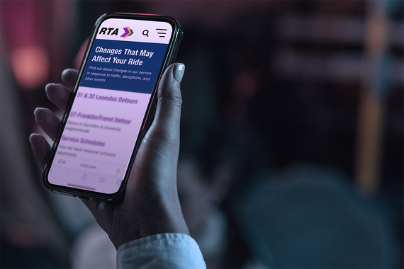 Rider holding phone, looking at norta.com