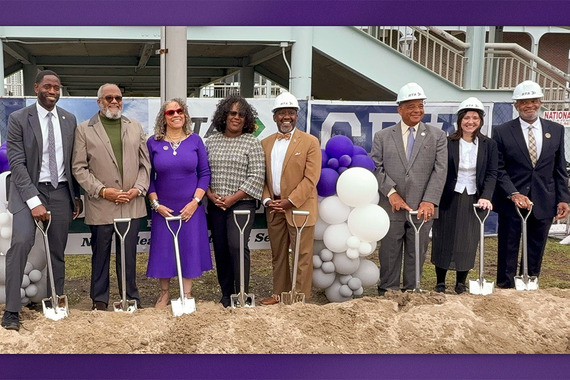 Group holding shovels at groundbreaking ceremony.