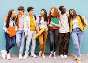 Happy college students standing in a group