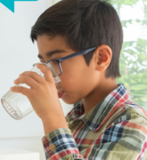 Child drinking glass of water