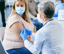 Women getting vaccine 