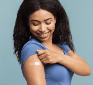 Woman who received a vaccine with a bandaid on her arm