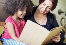 Women reading with her daughter