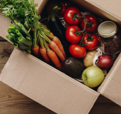 Fresh fruits and vegetables in a food distribution box